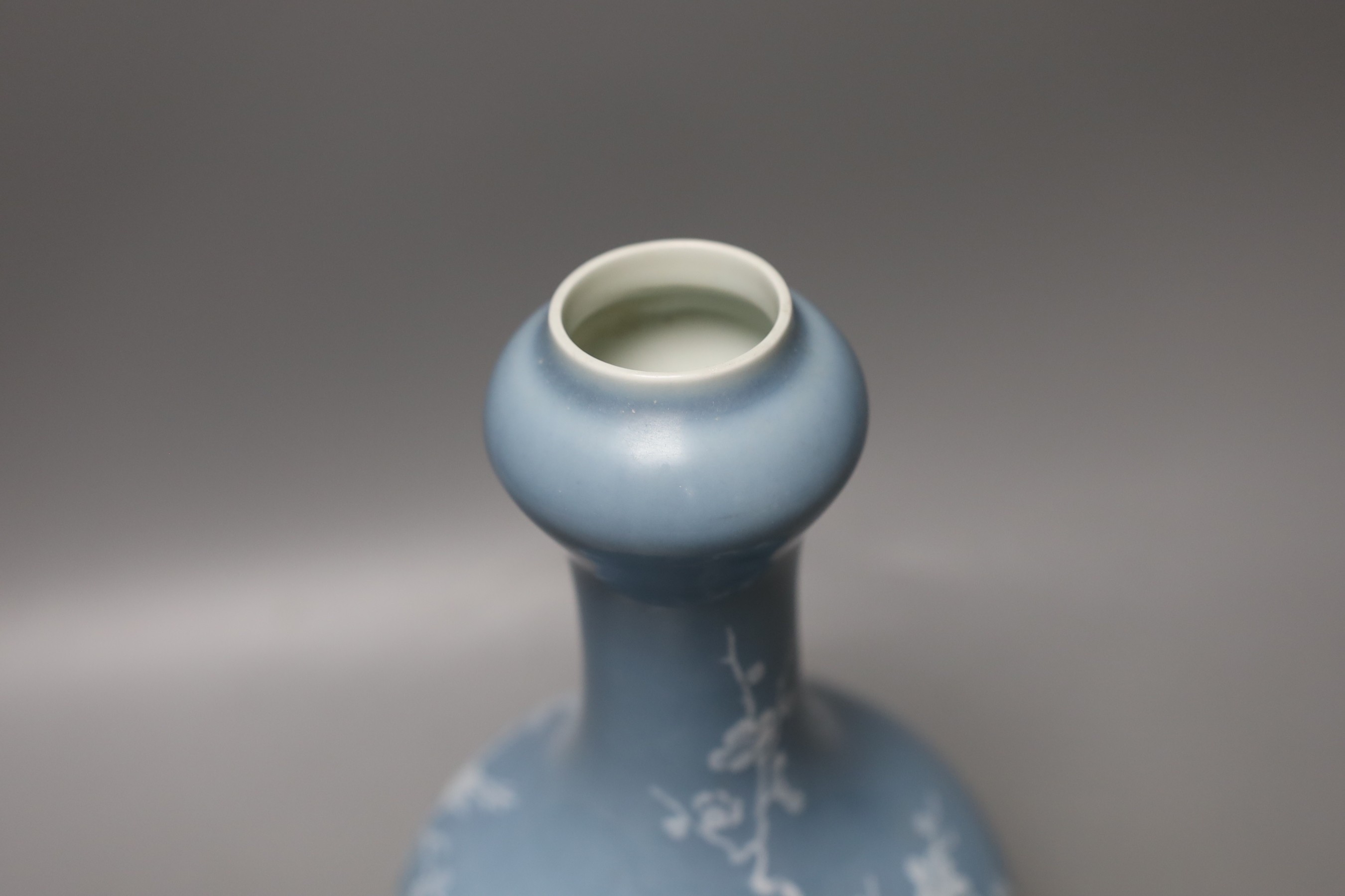 A Chinese claire de lune glazed white slip decorated vase - 25cm high
